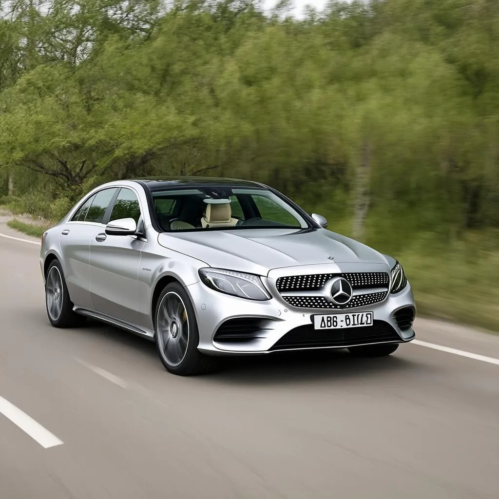 Silver Mercedes driving on an open road