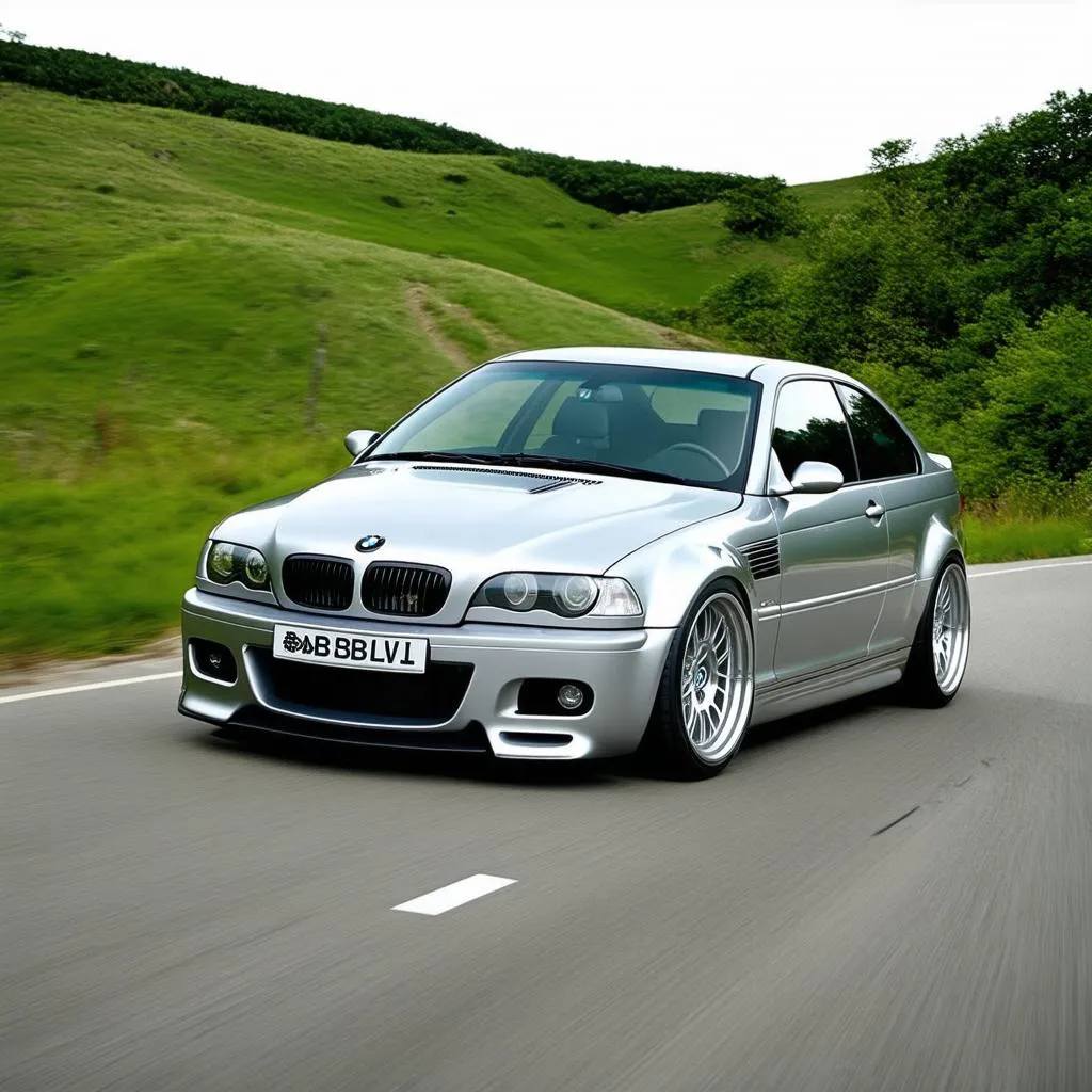 BMW M3 driving on a mountain road with BBS wheels