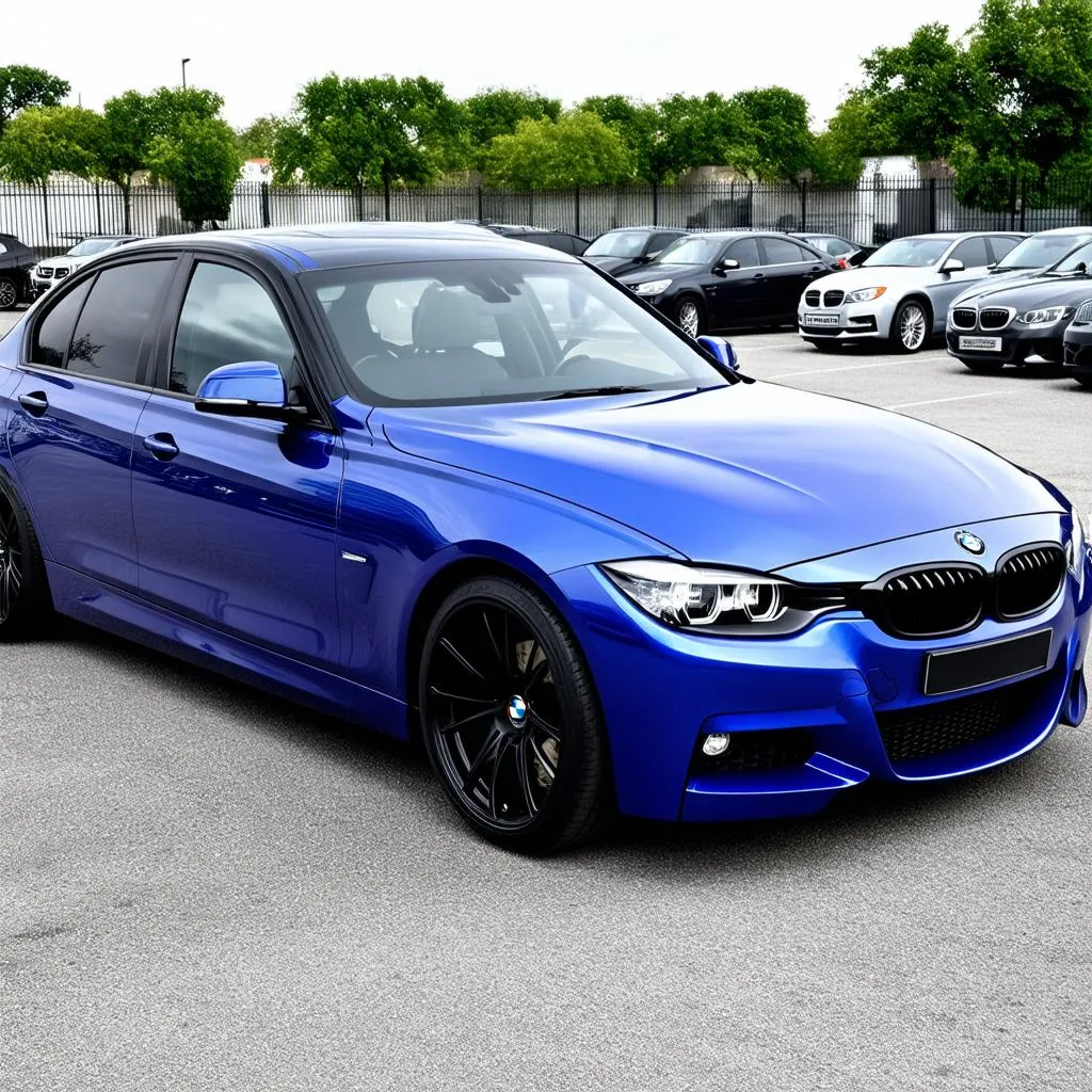 BMW 3 Series with Black Rims in a parking lot