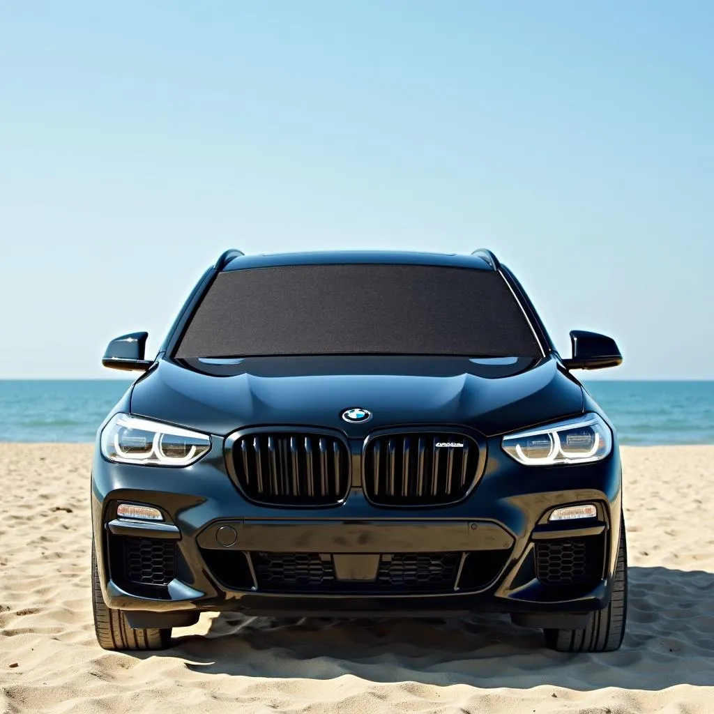 BMW iX parked on the beach with a sunshade