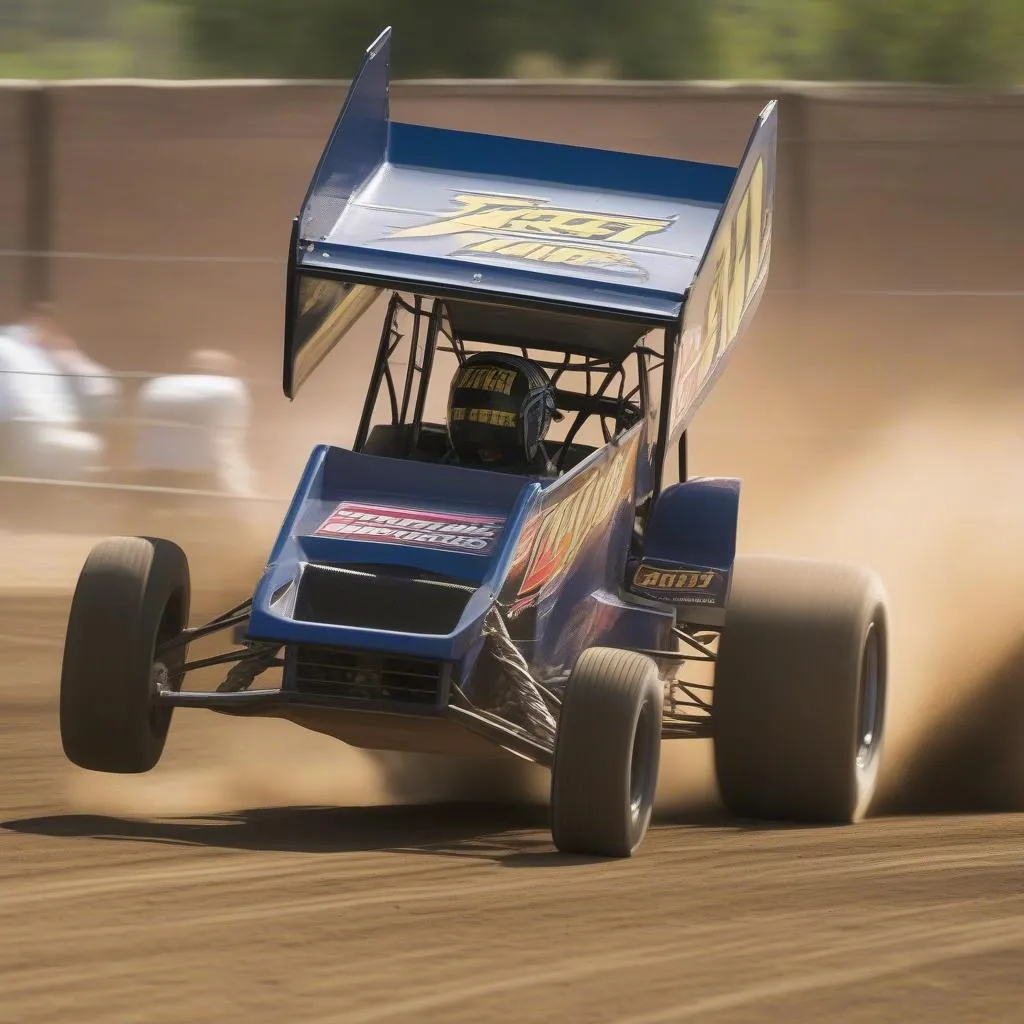 A sprint car racing on a dirt track