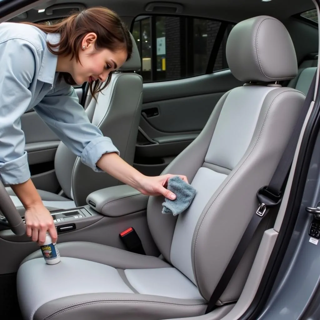 Person Cleaning Acura Integra Car Seat Covers