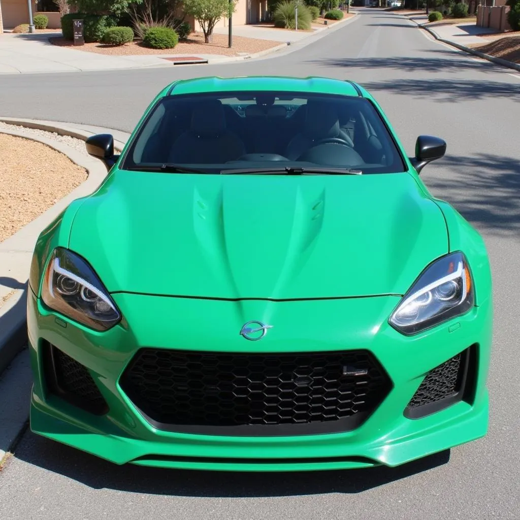 Sports car with a seafoam green car wrap