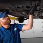 Inspecting the bottom of a car for a dragging splash shield