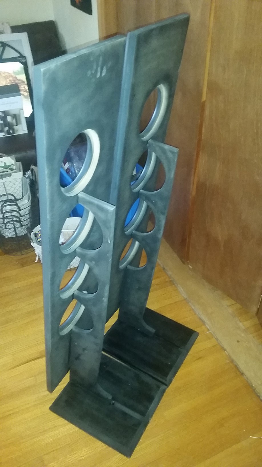 Front view of the completed DIY open baffle tower speakers in a home setting.