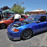 Two tuned Honda Civics from Bandits car crew parked at the Blox Open House 2012, showcasing aftermarket wheels and lowered stance.