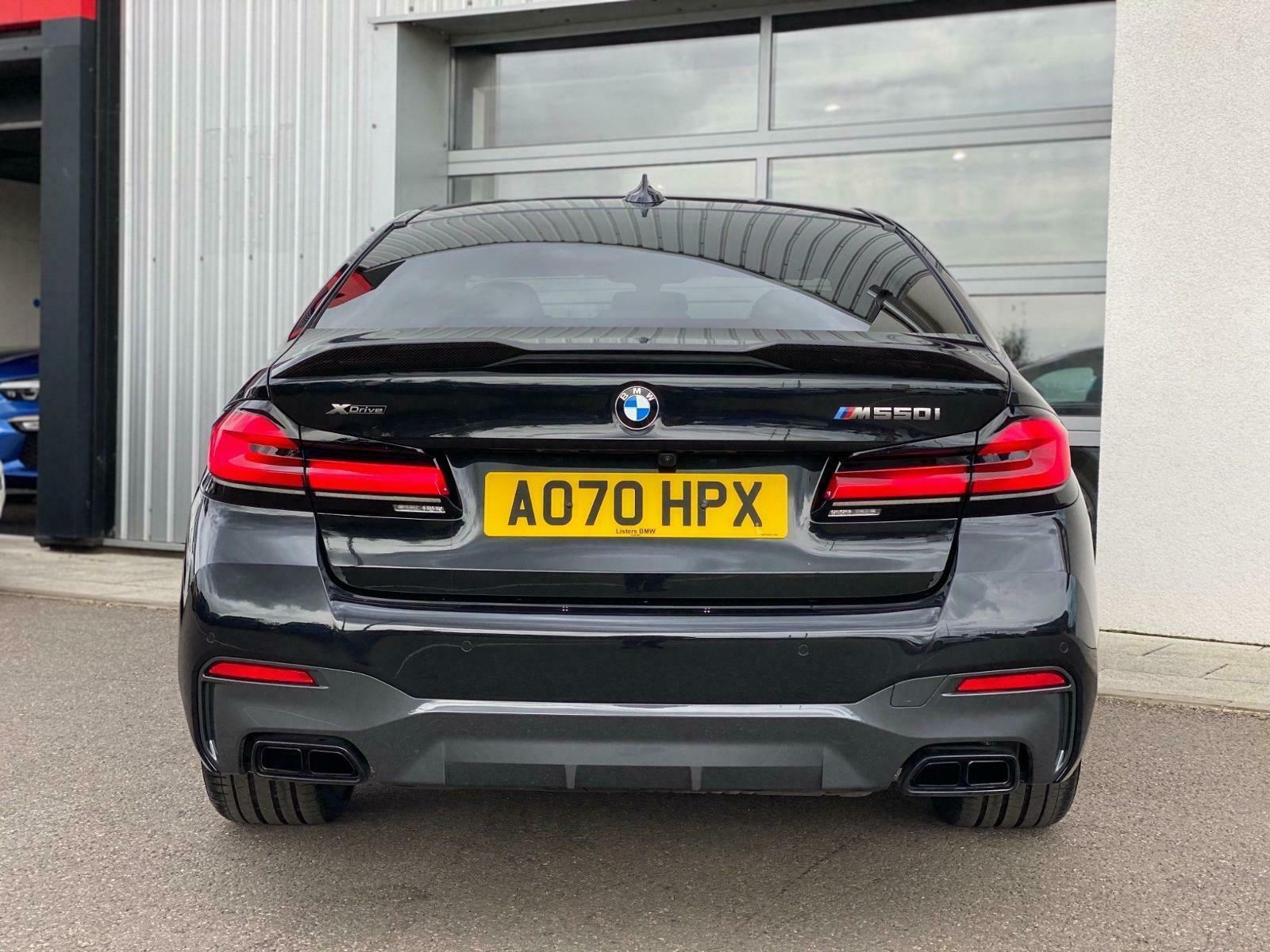 BMW G30 LCI M Sport rear bumper showcasing the factory diffuser part. This image highlights the subtle styling of the OEM rear diffuser on a G30 BMW sedan.