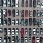 A wide view of the iPull-uPull Fresno junkyard lot filled with rows of cars, showcasing the extensive inventory of used car parts.