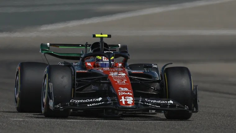 Close-up of a Formula 1 car's front wing, showcasing intricate aerodynamic details.