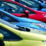 row of colorful cars in green, blue, and red