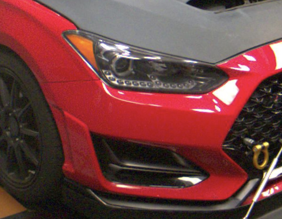 Close-up of Veloster N bumper showing vents and fascia elements that complicate canard car part mounting.