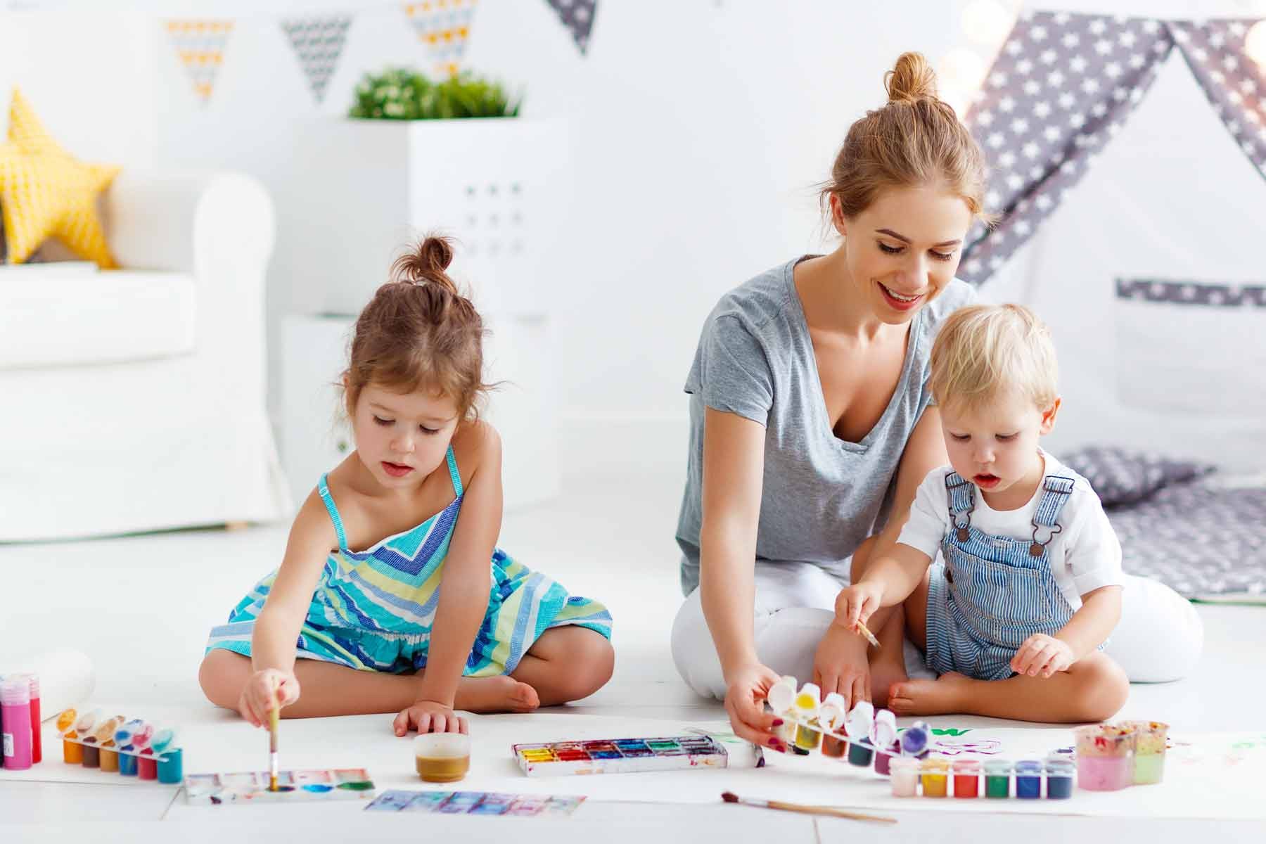 A babysitter playing with children