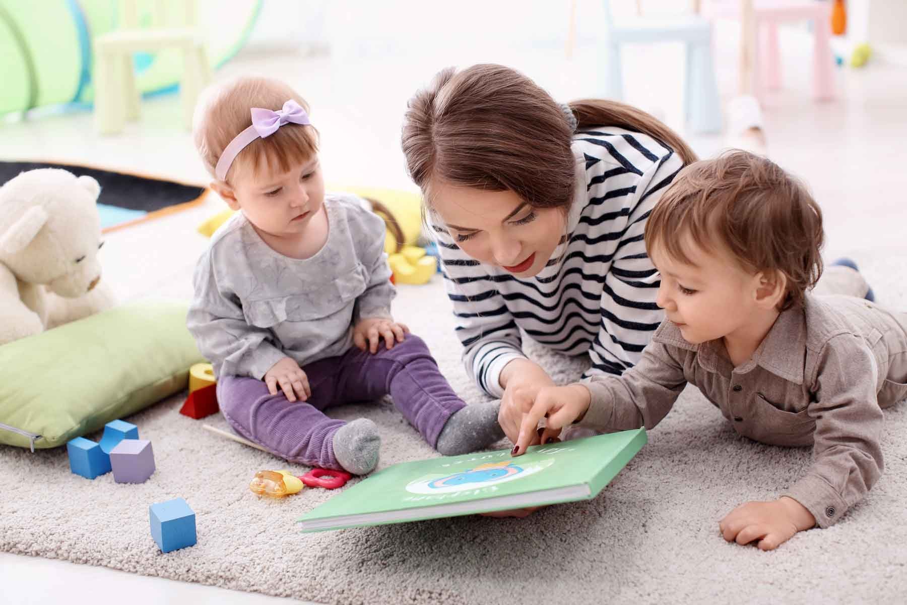 A nanny reading to children