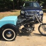 Vintage Harley-Davidson Servi-Car restoration project showcasing the frame and engine, highlighting the starting point for sourcing Harley Servi-Car parts